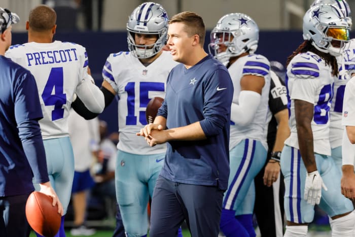 Kellen Moore walks the sideline before a preseason game